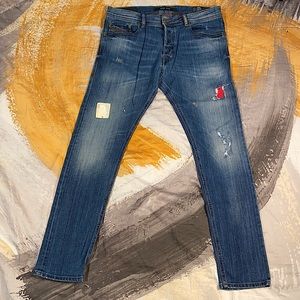 Diesel Slim Men's Jeans in Distressed Blue with Red Patch